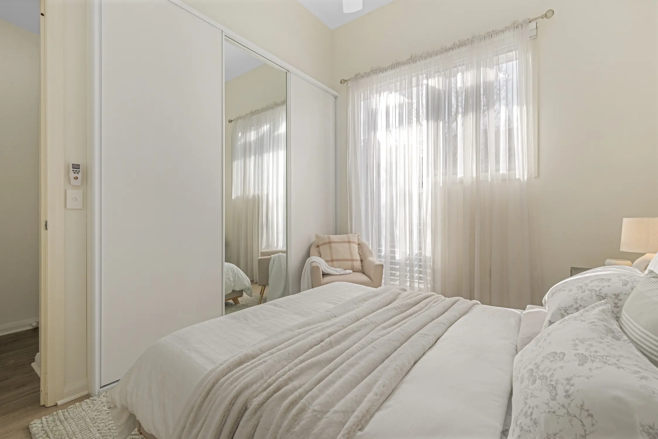 A white bedroom styled by Amor Home Styling.